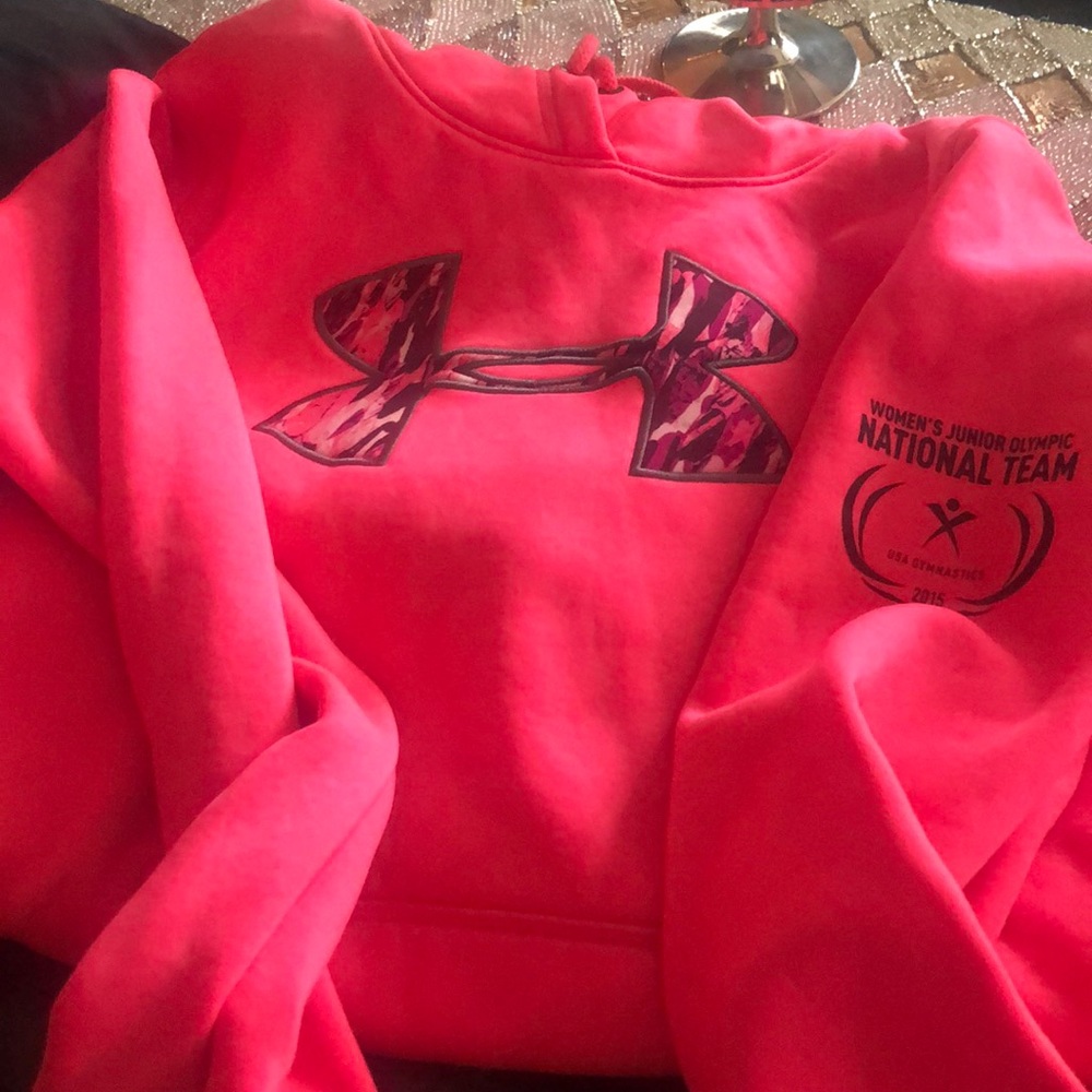 Medium, Pink Under Armour hoodie with camo decal.